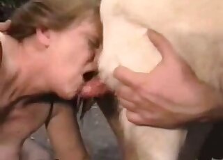 Gorgeous MILF hooker sucks a huge penis of her dog